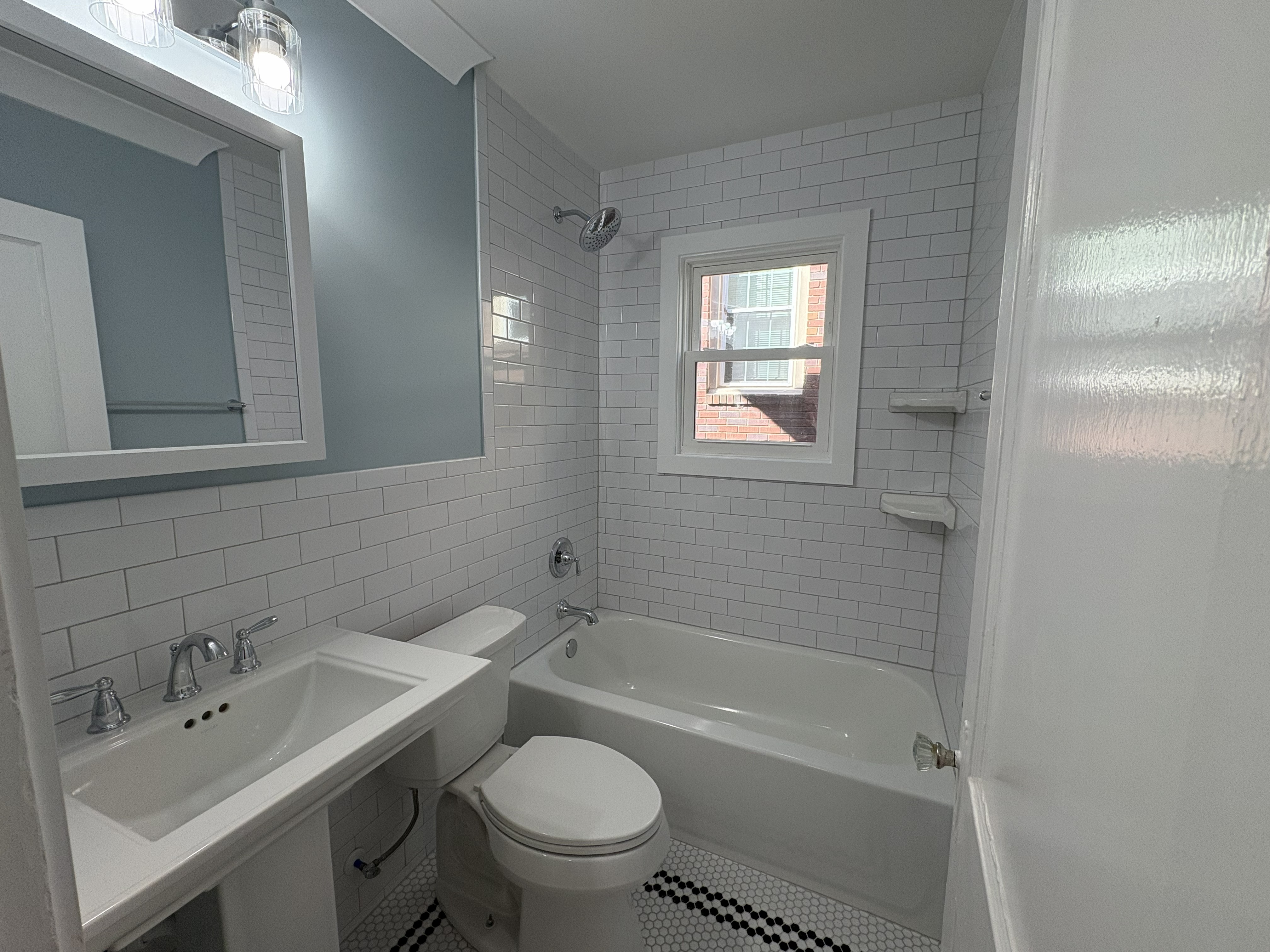 Renovated bathroom with subway tile and Moen chrome fixtures – 1412 Kenilworth Ave Dilworth Charlotte
